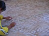 Kid_working_at_the_piece-1